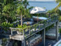 Noku Beach House - shaded wooden deck